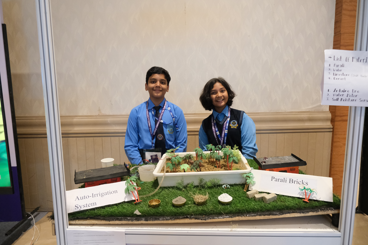 Student innovators presenting a sustainable irrigation model