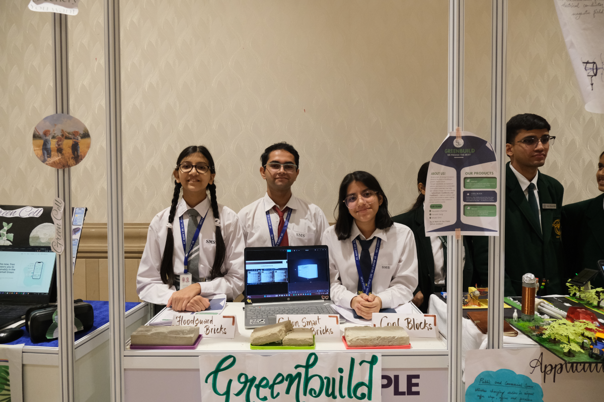A student team showcasing its green building innovation
