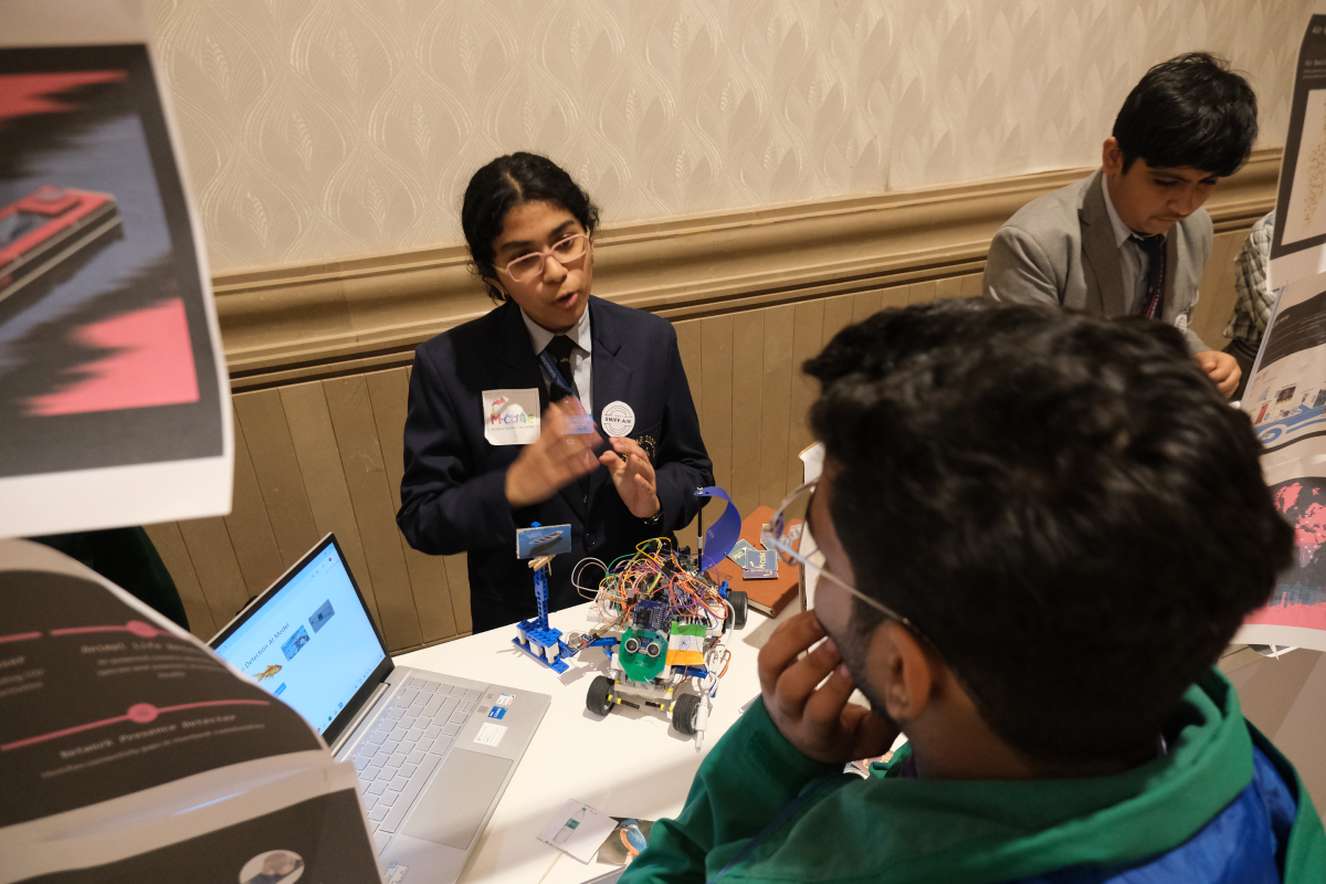 A student explaining a climate innovation prototype