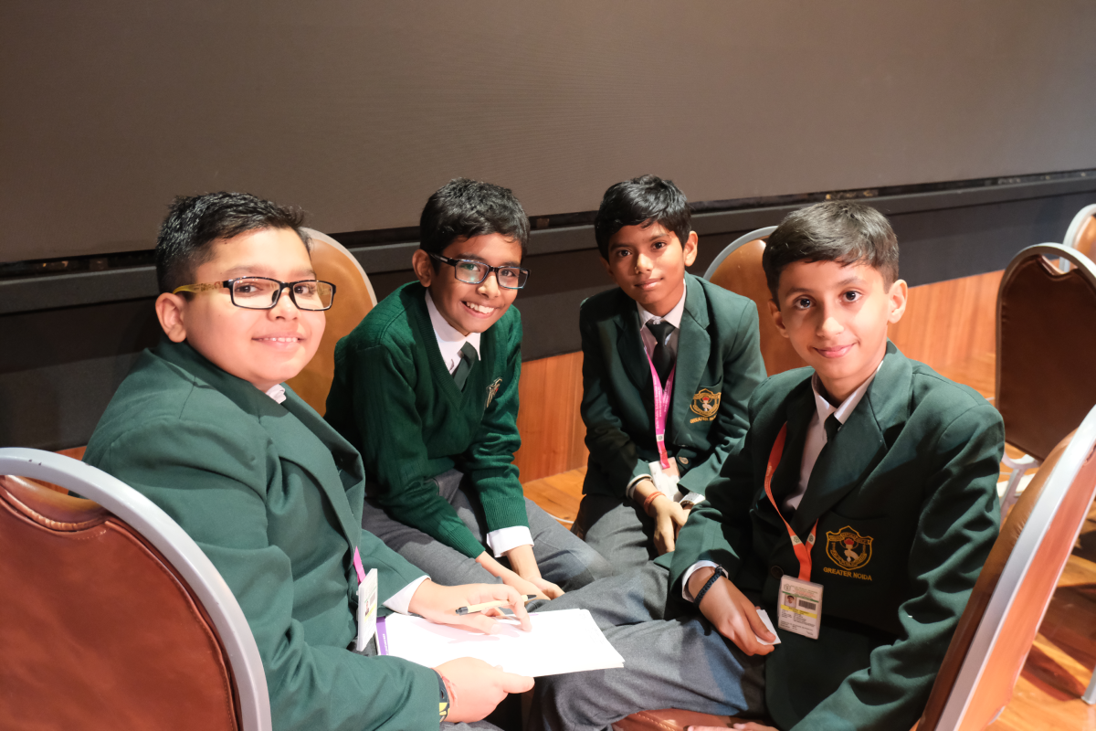 Young quiz participants working together as a team