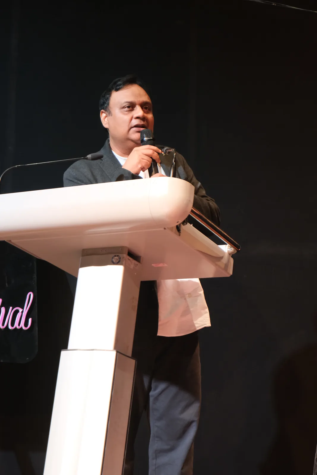 A speaker addressing the Climate Talks audience