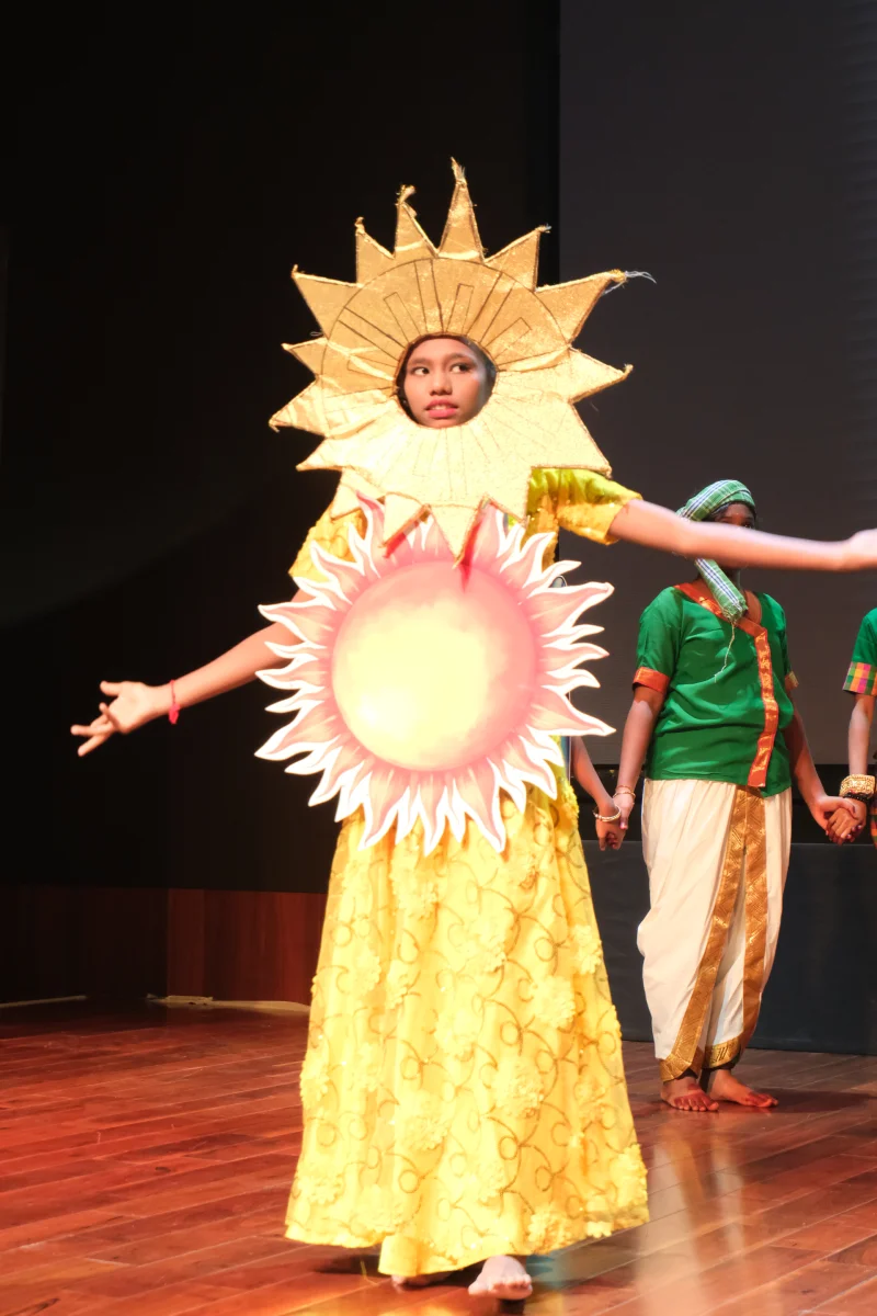 Student portraying the sun in a climate theatre performance