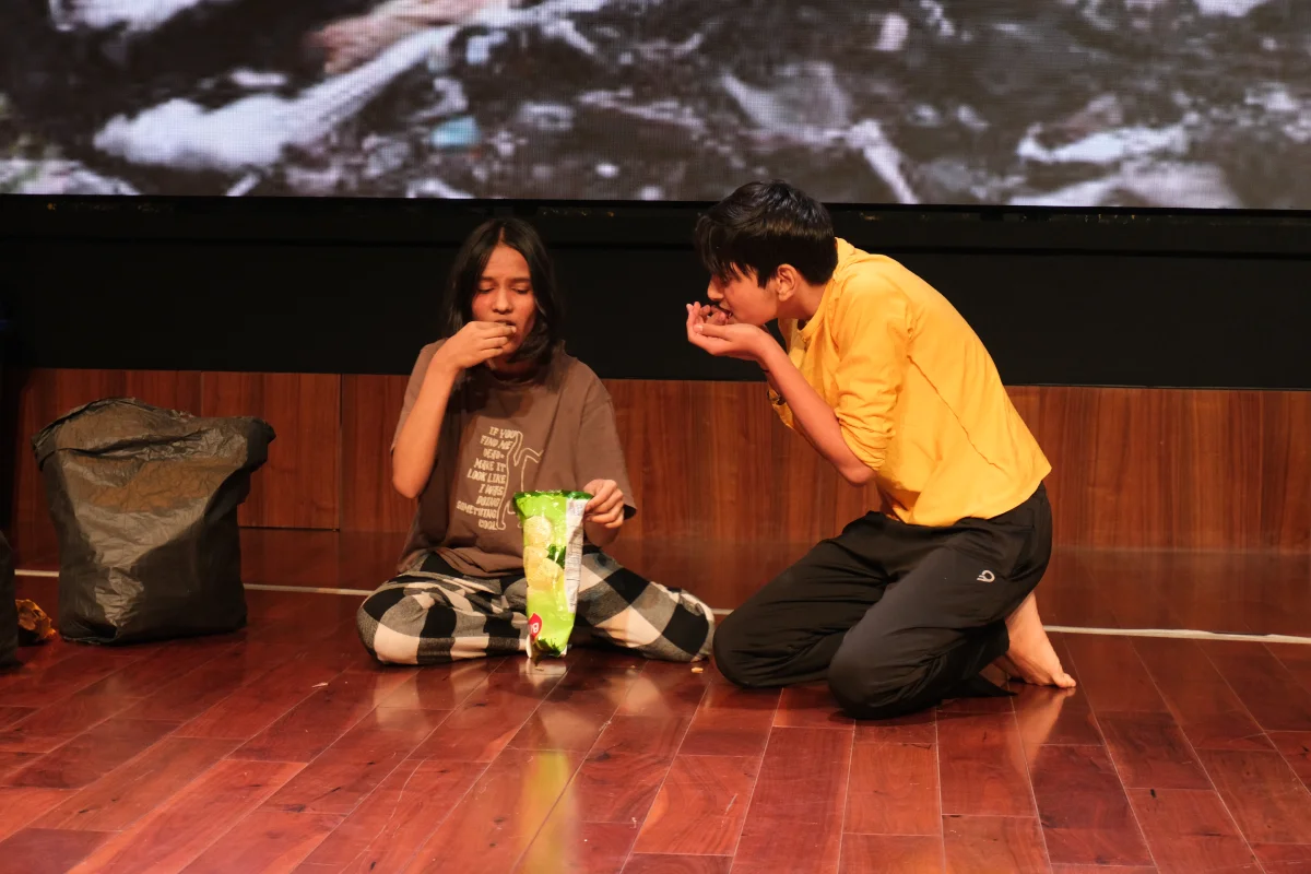 Students acting out an environmental scene
